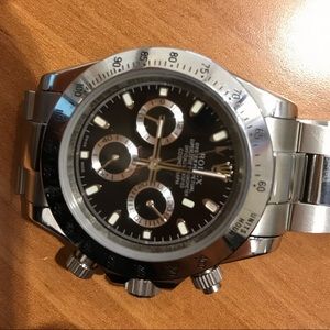 Rolex Daytona. Works fine has minor damage